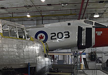 Avro Lancaster being restored alongside the full-sized Avro Arrow replica CanadianAirAndSpaceMuseum-AvroLancasterAndAvroArrowReplica-Feb2109.jpg