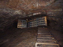 Cheddar cheese maturing in the caves at Cheddar Gorge Cheddar cave cheese.jpg