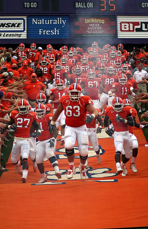 The Tigers take the field by running down the hill in Memorial Stadium's east end zone.