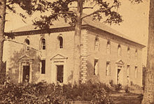 This image, cropped from a stereoscopic photograph taken sometime after the Civil War, shows the state to which Pohick Church had been reduced. Note the missing windows and doors. Crop of stereoscopic view of Pohick Church.jpg