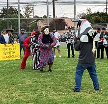 La Borracha confronts el Torito in the Danza del Torito, as performed in Gardena CA in 2024 DanzadelToritodeRomita.jpg