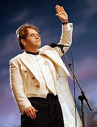 Elton John (pictured) topped the Year-End chart with his double-sided single, "Candle in the Wind 1997" / "Something About the Way You Look Tonight", which was at the top of the Hot 100 for 14 weeks. Elton John with Luciano Pavarotti in Modena 1996 (2).jpg