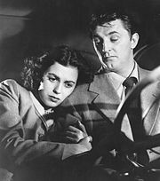 Scene with Domergue and Mitchum Faith Domergue and Robert Mitchum 1950.jpg