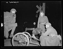National Guardsmen with machine guns overlooking Chevrolet factories number nine and number four Flint Sit-Down Strike National Guard.jpg