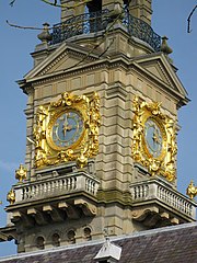 Gilded surrounds of the clock faces on the tower