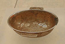 An "eared" metal rice wine cup (Yu Shang ) from the Tang dynasty period, China Gilt silver eared cup.jpg