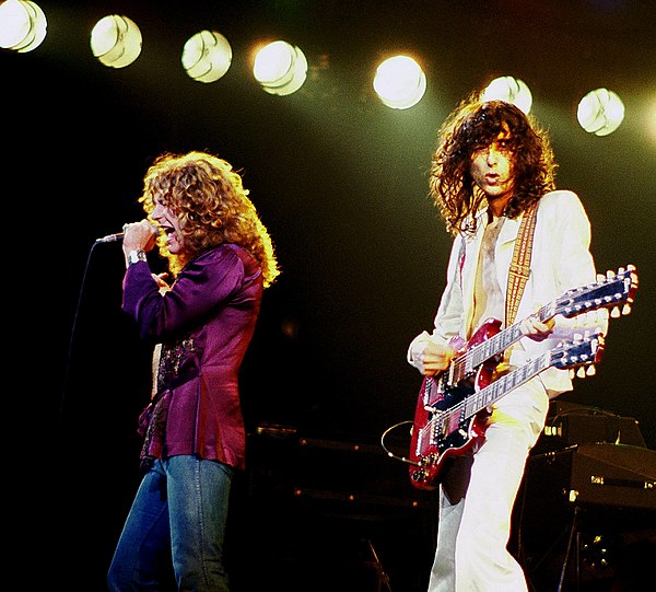 Robert Plant (left) and Jimmy Page (right) on stage in Chicago at Chicago Stadium, April 10, 1977. Jimmy Page with Robert Plant 2 - Led Zeppelin - 1977.jpg