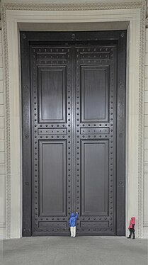 Knocking at front door of The National Archives Building in DC