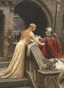 Une jeune femme vêtue d'une robe de satin crème de style médiéval attache une écharpe rouge au bras d'un homme en armure et monté sur un cheval.  La scène se déroule au portail d'un château.