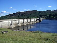 The dam wall with the gatehouse in the middle which releases compensation water for the Errochty Water. Loch Errochty dam wall 7.jpg