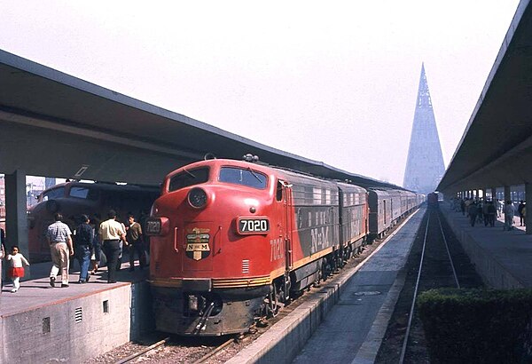 An N de M passenger train at Mexico City in the 1960s, the Torre Insignia in the background