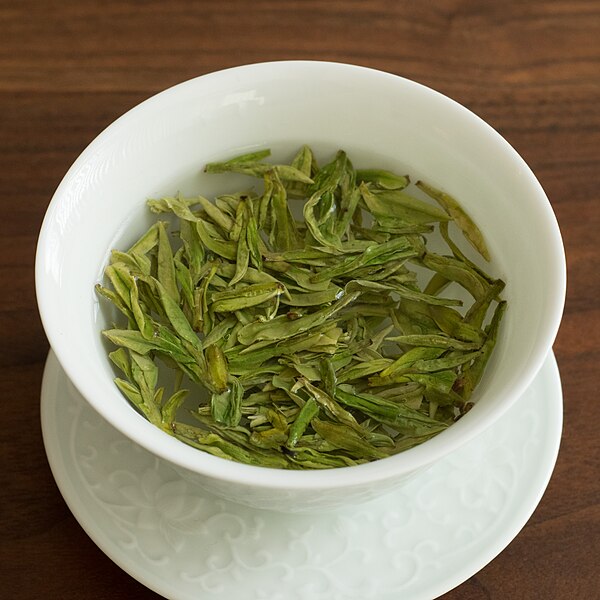 Longjing green tea being infused in a gaiwan