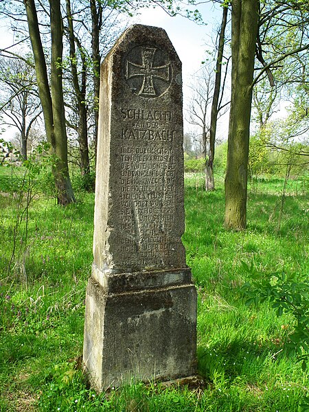 Memorial stone; it reads, in German, "Here the French crossed the Raging Neisse and were repulsed, many of them drowning in the flooding river."