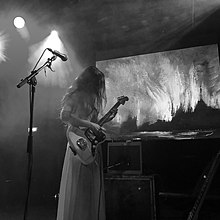 Marissa Nadler performing in 2019 before a reproduction of her painting "For my Crimes" in Groningen Marissa Nadler live in Groningen.jpg