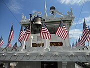 The Mark Twain riverboat's wheelhouse and bell Mark Twain Riverboat pilothouse.jpg