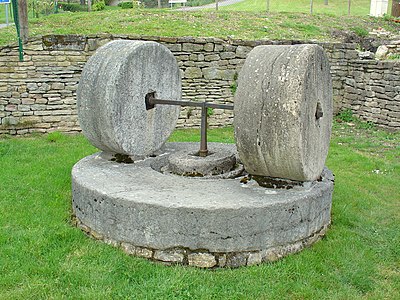 Pair of millstones used to grind gypsum before firing. Berzé-la-Ville