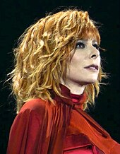 The pop-singer Mylene Farmer holds the record for the most number one hit singles in the French charts. Mylene farmer Live 2019 (cropped).jpg