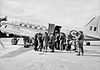 Commonwealth troops wait to board a Douglas C-47 Dakota of No. 30 Transport Unit (formerly No. 30 Communications Unit) at Iwakuni, Japan, in 1952