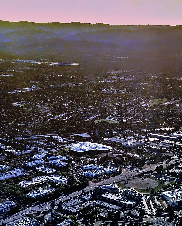 Aerial view of Endeavor, the first of the two new Nvidia headquarters buildings, in Santa Clara, California, in 2017. Apple Park is visible in the dis