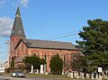 Our Mother of Sorrows Roman Catholic Church Complex (ca. 1858–1878) at the intersection of Latta Road and Mt Read Blvd. Added to the National Register of Historic Places in 1989.