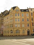 Apartment building in a corner location with a restaurant in a closed development