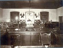 Regina Court House 1900, Victoria Avenue and Hamilton Street. Pictured are Dixie Watson (seated right), Court Clerk; J. M. Duncan; Justice Newlands. RPL-B-510.jpg