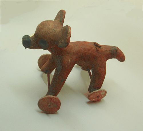 A figurine featuring the New World's independently invented wheel. Among the places where wheeled toys were found, Mesoamerica is the only one where t