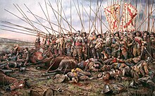 Rocroi, el ultimo tercio ("Roicroi, the last tercio") by Augusto Ferrer-Dalmau, portraying infantry of a battered Spanish tercio at the 1643 Battle of Rocroi Rocroi, el ultimo tercio, por Augusto Ferrer-Dalmau.jpg