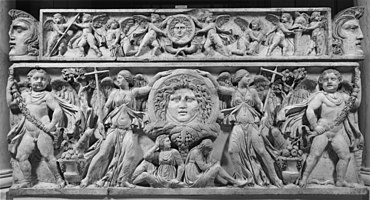 A typical depiction of Roman victory, showing two Victories holding standards in the battlefield. Roman - Sarcophagus with Victories - Walters 2336.jpg