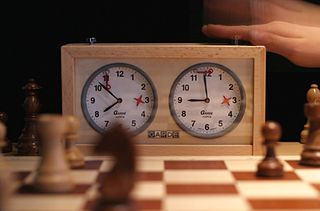 <span class="mw-page-title-main">Chess clock</span> Two adjacent clocks with stop/start buttons