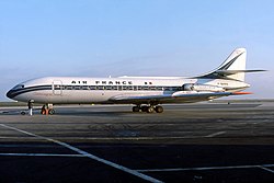 La brigade voyage d'abord à Paris à bord d'une Caravelle (nommée « Gascogne ») puis rejoint New York à bord du paquebot France.