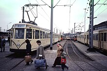 NMVB interurbans at Oostende in 1982, on the surviving Belgian Coast Tram line. A more recent photo can be seen at top. Tram Oostende NMVB 2.jpg