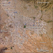 Tucson, as seen from space. The city's four major malls are indicated by blue arrows. TucsonAZ ISS009-E-10382.jpg