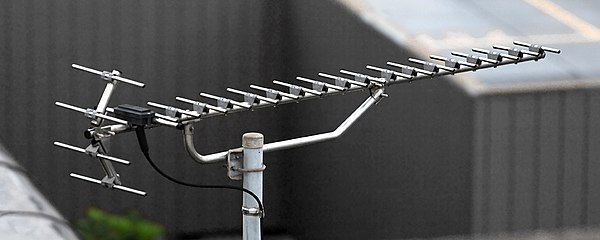 A modern high gain UHF Yagi television antenna. It has 17 directors, and one reflector (made of 4 rods) shaped as a corner reflector.