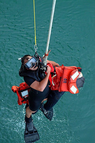 File:US Navy 041029-N-4772B-115 Search and rescue swimmer, Personnelman 3rd Class Gerardo A. Arbulu, gives the thumbs-up signal to be raised out of the water.jpg