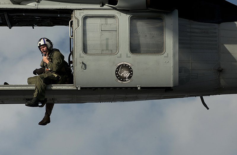 File:US Navy 111220-N-DR144-761 A Naval Air Crewman assigned to Helicopter Sea Combat Squadron (HSC) 12 guides the pilots of an MH-60S Sea Hawk helicopt.jpg