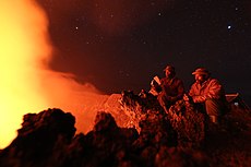 Virunga National Park, DR Congo- Two guards of the Virunga National Park contemplate the lava of Nyiragongo crater, which rises to 3470 meters (24266746605).jpg