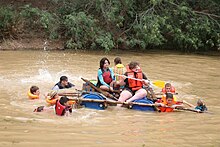 Voortrekker children taking part in a raft race at Bruintjieskraal in the Baviaanskloof, South Africa. 2021 Voortrekker vlotvaart.jpg