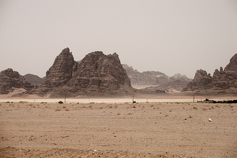 File:Wadi Rum rock formations along with Bedouin camps, Jordan.jpg