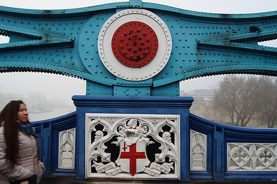 Coat of arms on London Tower Bridge taking during a foggy day