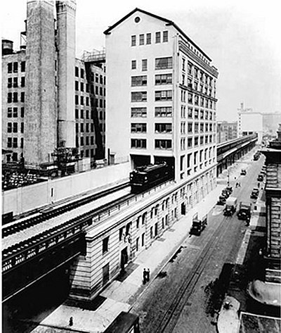 A New York Central train running on the High Line through the Bell Laboratories Building, 1936