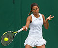 Çağla Büyükakçay competing in the first round of the 2015 Wimbledon Qualifying Tournament at the Bank of England Sports Grounds in Roehampton, England. The winners of three rounds of competition qualify for the main draw of Wimbledon the following week.