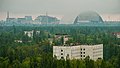 Image 102The town of Pripyat abandoned since 1986, with the Chernobyl plant and the Chernobyl New Safe Confinement arch in the distance (from Nuclear power)