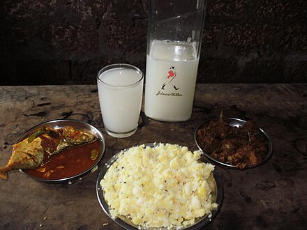 Toddy is an iconic alcoholic drink in Kerala and is usually drunk as part of a meal. Here with tapioca, fish and rice.