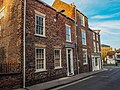 12 and 13 St Saviour's Place. Two houses, late C18 and early C19, now offices, flats and shops. Grade II listed.