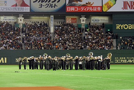 The U.S. 7th Fleet Band and U.S. Army Japan Band perform during the MLB Japan Opening Series 2008.