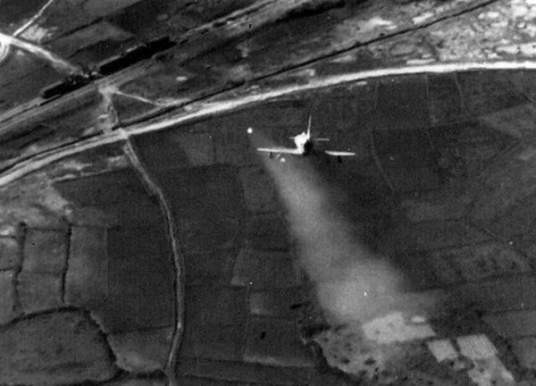 A U.S. Navy Douglas A-4 Skyhawk attacking a train in North Vietnam with a Zuni rocket