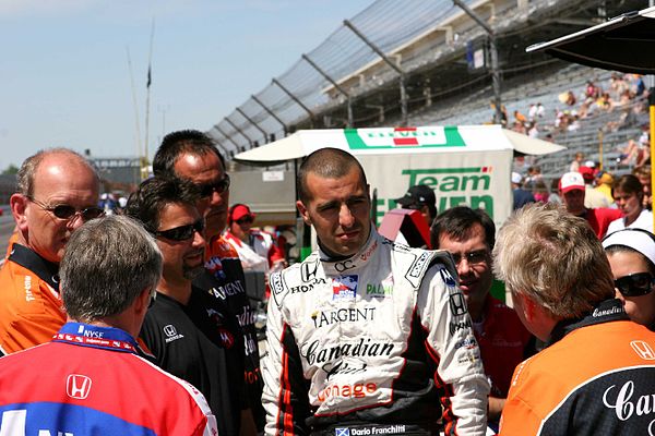 Members of Andretti Green Racing have a meeting on pit road at the Indianapolis Motor Speedway in May 2007.