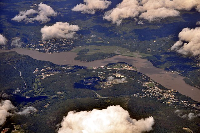 Aerial view of West Point (at the center), the Hudson River, Highland Falls (on right), Cold Spring (on left) across the river in Putnam County