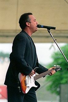 Joel performing in June 1994 Billy Joel with guitar 1994.jpg